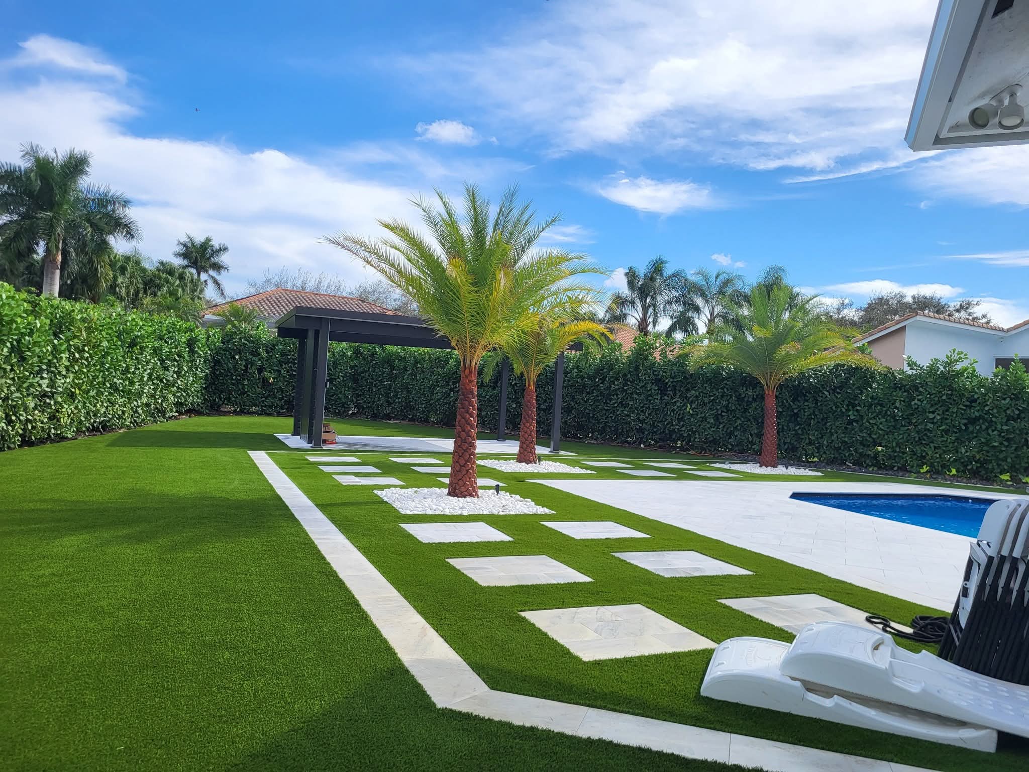 Tropical backyard install with palms